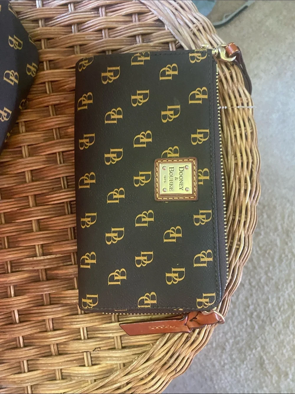 Dooney & Bourke dark brown and Gold Monogram Wristlet